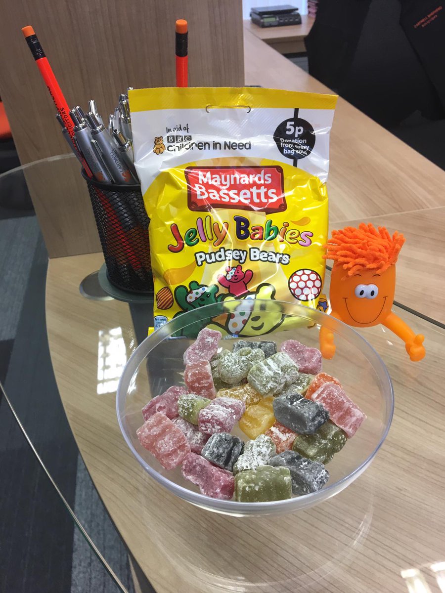 CartmellsWest's tweet photo. @CartmellsWest are supporting children in need in the office today. Here's Gemma modelling a #pudseybear t-shirt and our #cartmells orange man guarding the sweets #BBCchildreninneed #childreninneed2018 #PudseyBear https://t.co/VkP9laQDkz