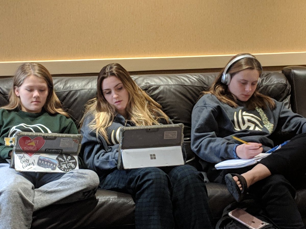 NDPvball's tweet photo. Putting the student in student-athlete. Girls working hard to keep up on their school work btn matches. Excellence in the classroom, community, and on the court. Irish Volleyball https://t.co/PW0AtjWFSy