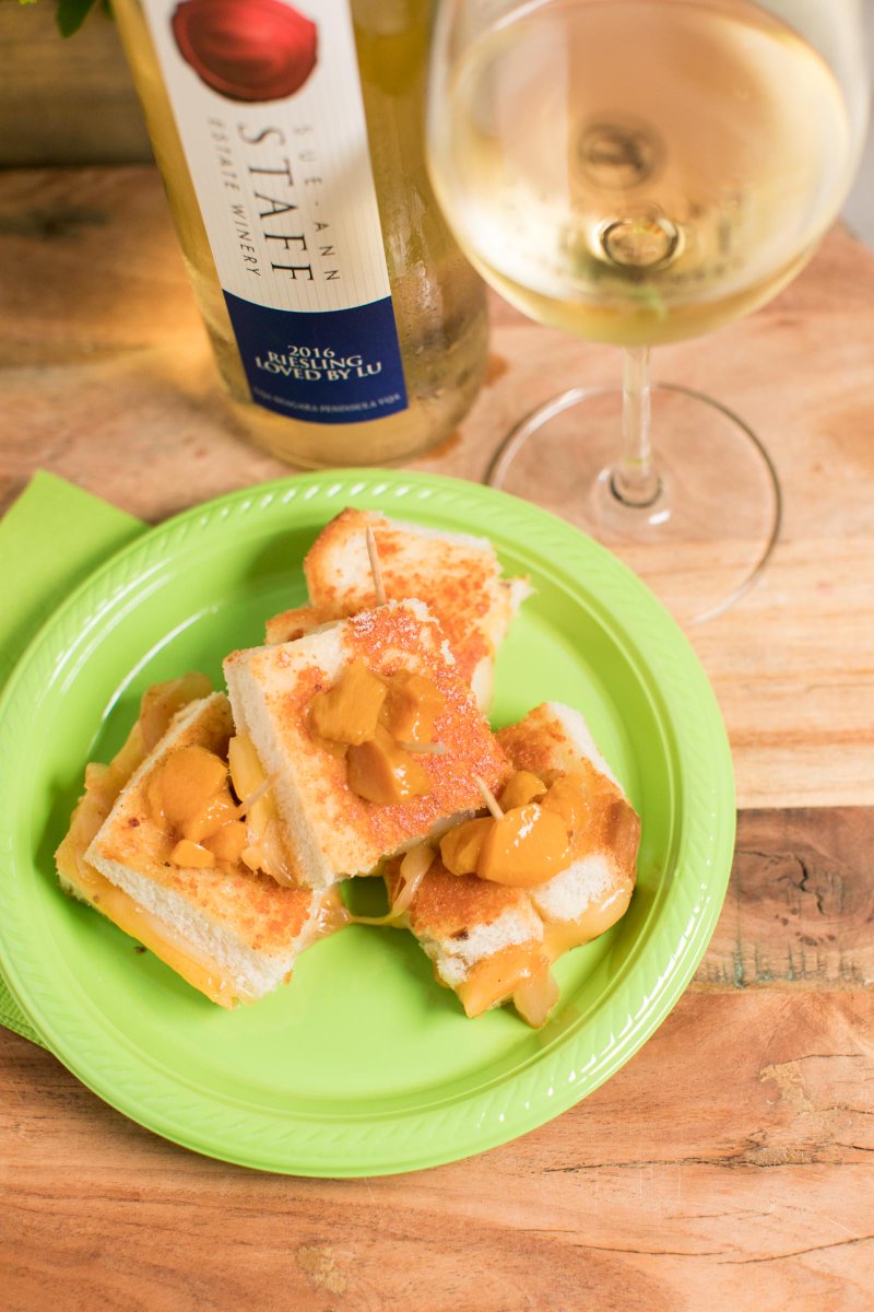 SueAnnStaff's tweet photo. The sandwich elves are building #grilledcheese sandwiches today to get ready for #WrappedUpInTheValley wknd 2! Miz Lula's Peach State Gourmet Grilled Cheese is a glorious combo of smoked cheese, caramelized onions, BBQ sauce & peach bourbon compote! #wrappedup #twentyvalley https://t.co/D8GuSVca9x