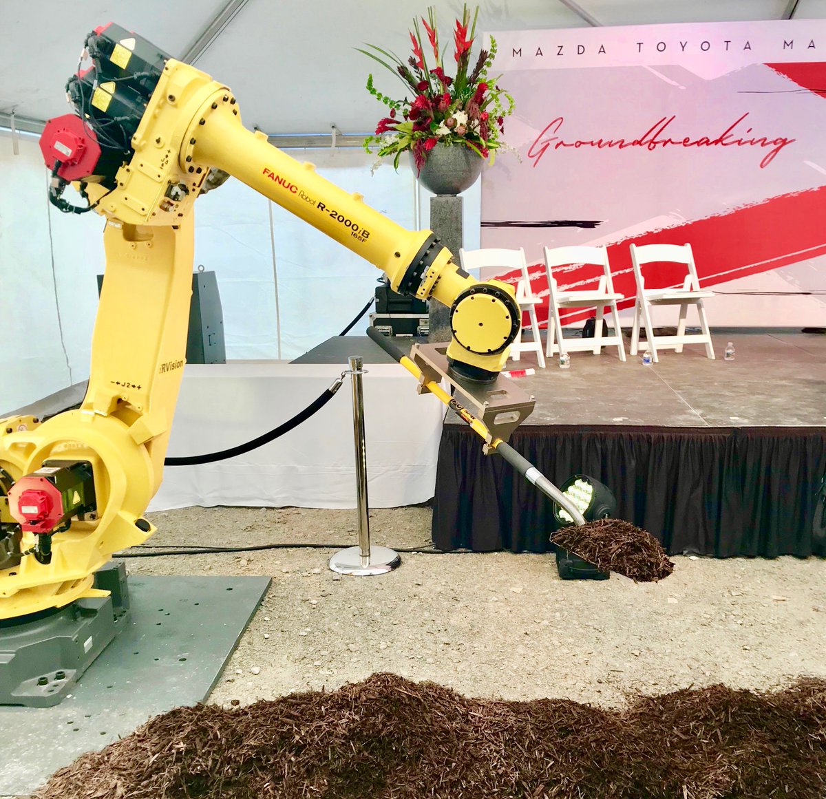 MadeinAL's tweet photo. BREAKING: With help from a robot armed with a shovel, Mazda Toyota Manufacturing USA officially kicks off construction on Alabama assembly plant with groundbreaking ceremony in Huntsville https://t.co/ixb5SGiS23 https://t.co/71gCSC2EuK