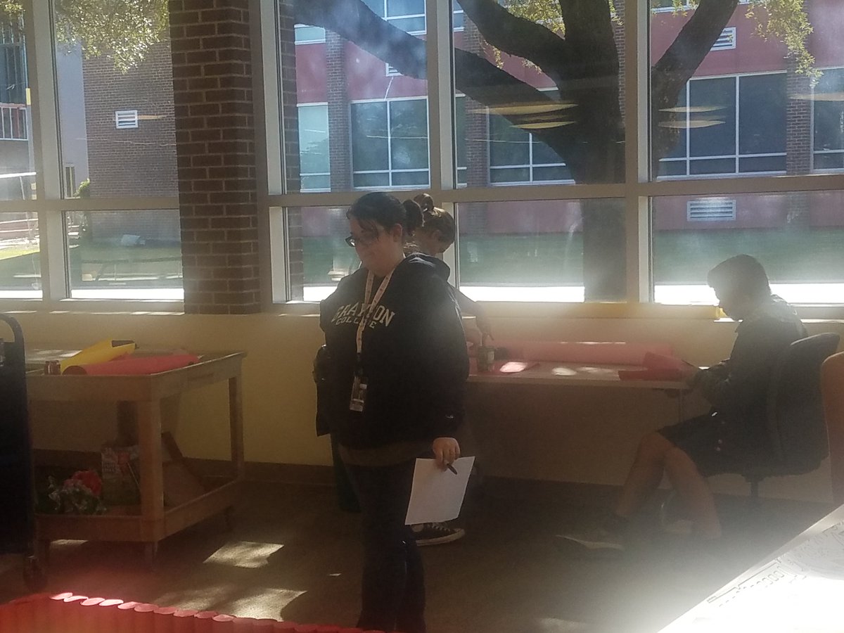GraysonLibrary's tweet photo. Staff, and students working diligently on the Canstruction project. Can you tell what it is going to be? #Canstruction2018 https://t.co/1JaTy2ZPG1