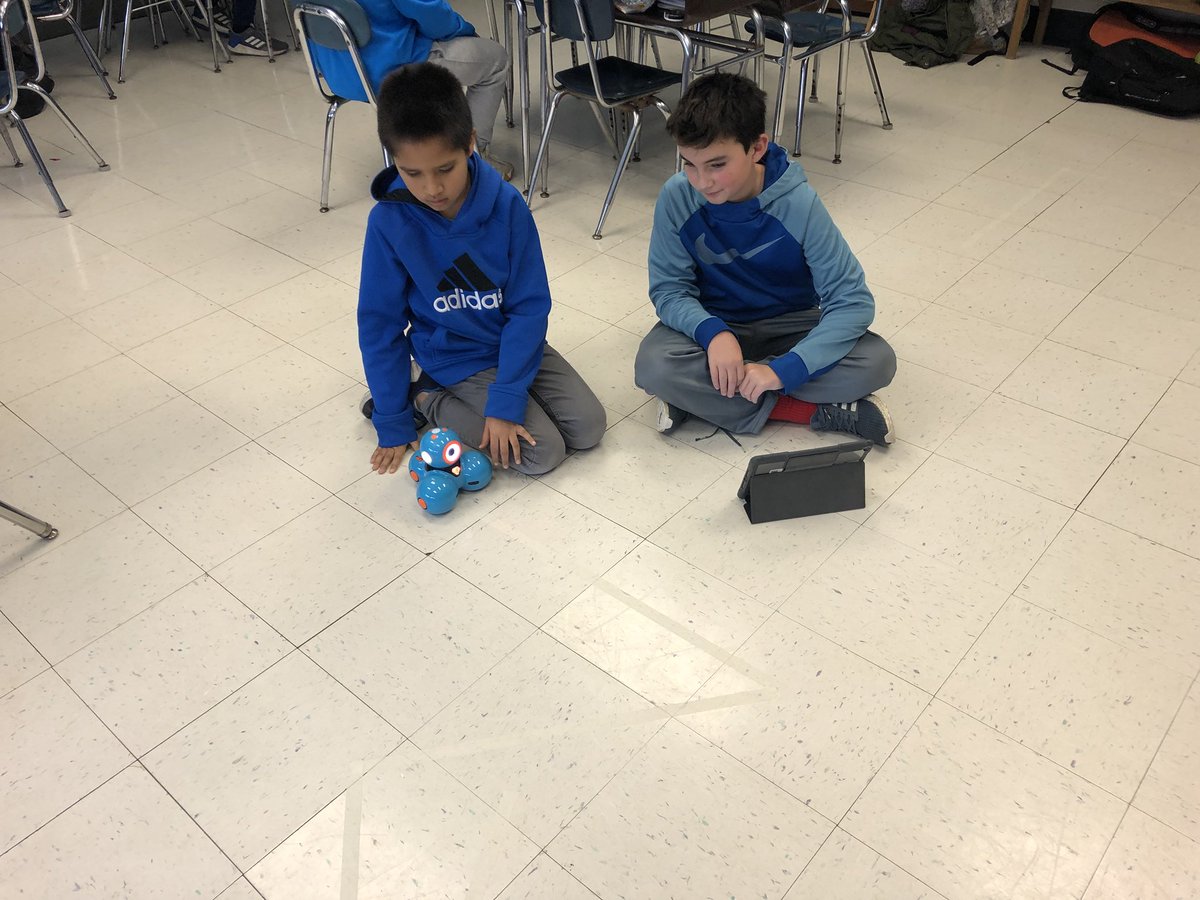 Ss worked hard getting the dash robots to travel along the tape line!