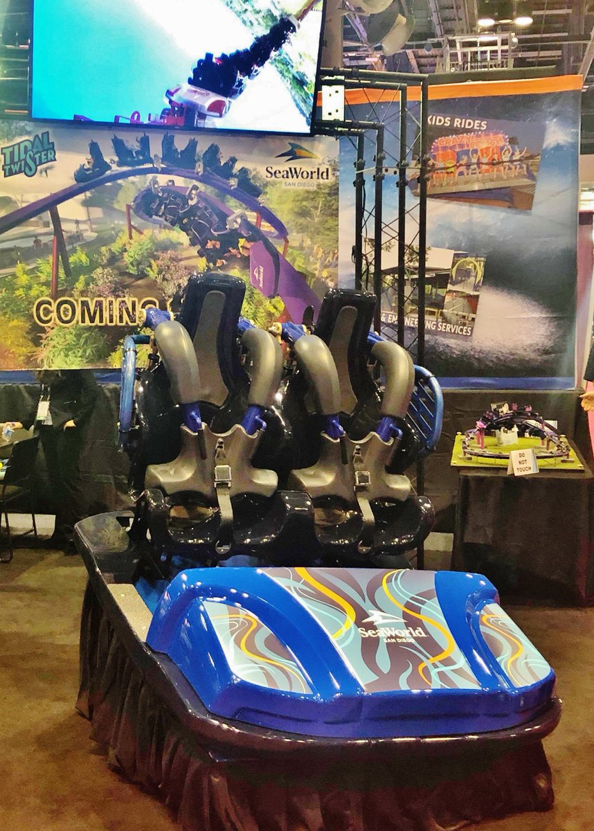amusementtoday's tweet photo. TIDAL RAVE: A lead car from Tidal Twister, set to open next May at #SeaWorld #SanDiego, on display @#IAAPA #Attractions Expo 2018 in Orlando. It is a Skywarp Horizon – the horizontal version of @SkylineAttrax' Skywarp figure-8 coaster. Dueling fun includes a zero-G roll. #IAE2018 https://t.co/ttgNBwAYFv