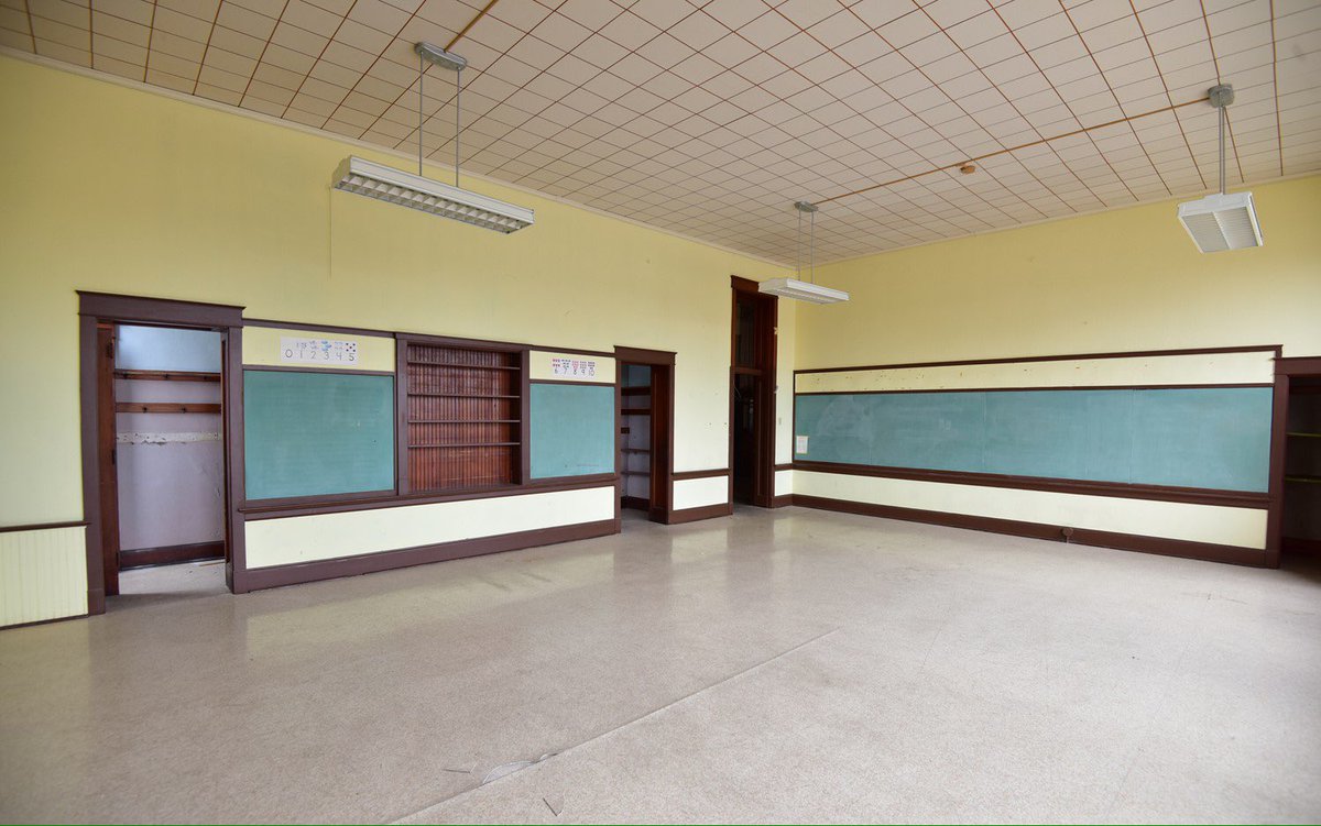 kansashistory's tweet photo. Typical classroom with chalkboards, shelves, trim, and coat closets.  @cityoftopeka @PresTopeka #education #kshistory https://t.co/MtKicQcsDY