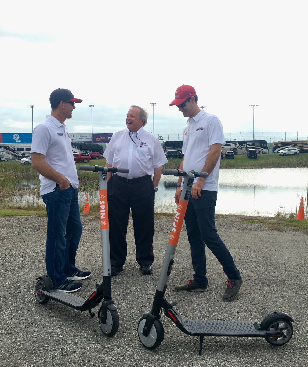 Edsel Ford presenting ⁦@ridespin⁩  scooters to ⁦@KevinHarvick⁩ and  ⁦@joeylogano⁩. #NASCAR #FordChampWknd ⁦@FordPerformance⁩