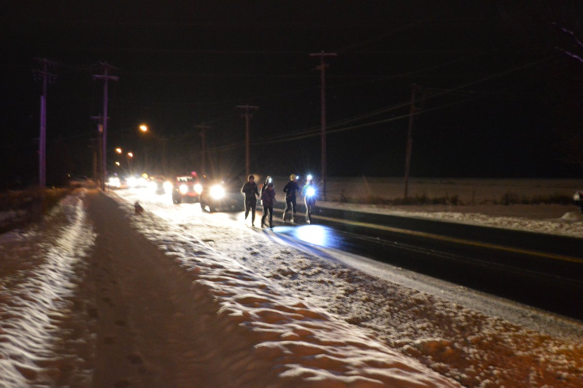 SUNYPotsdamPD's tweet photo. The 110 Mile National Adoption Day Run traveled through Potsdam last night. Runner Jess Hurlbut was briefly joined by our own Lt Ashley on a chilly and slippery night for a great cause. Read more about National Adoption Day at: https://t.co/J9kElAfLkc https://t.co/eM3i55NwDW