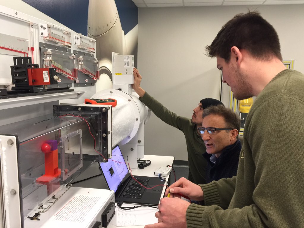 SHSUEngrTech's tweet photo. #SHSUEngTech seniors are testing a small-scaled wind turbine unit under extreme wind speed values in a wind tunnel; also improving operation using #LabVIEW DAQ @SamHoustonState @WindEnergyPower @TXWindEnergyInt https://t.co/BeQJZgFsZu
