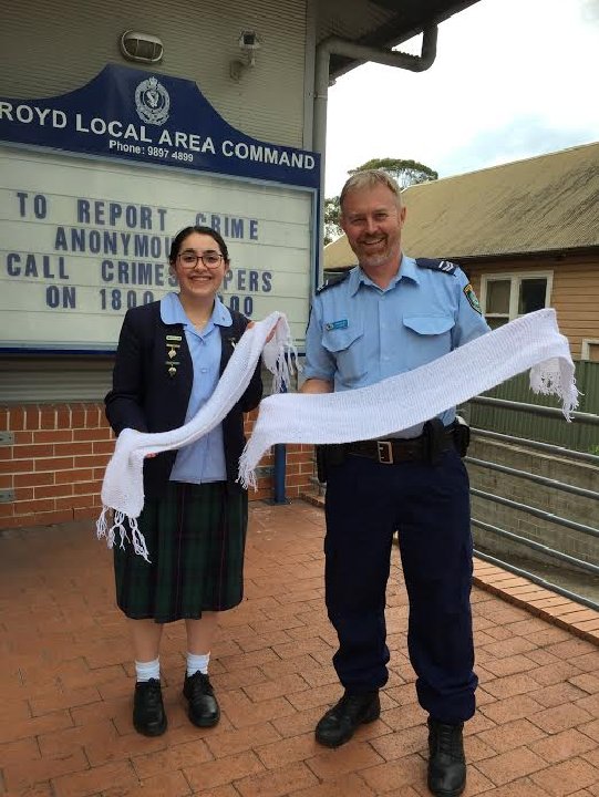 "Students and teachers enthusiastically knitting to support Family and Domestic Violence"