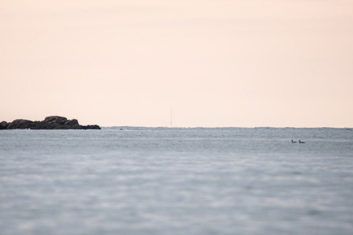 I THEN crouched down and took this picture a second or two after the last one. I'm 5'6", so here I was probably only 2 feet above the water's surface. That minimizes the distance from my eye (and lens) to the horizon BECAUSE OF CURVATURE.