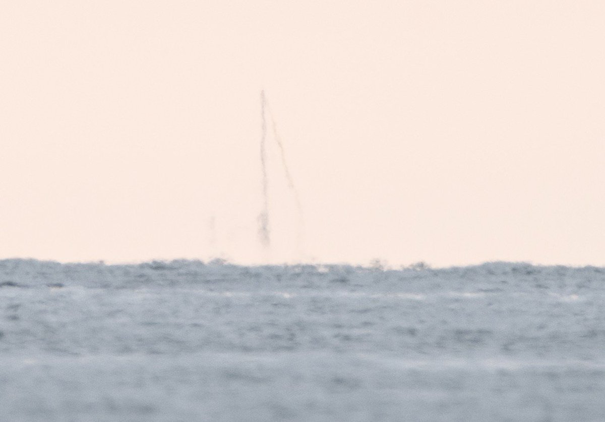 When I zoom in even further digitally there's a lot of refraction through several miles of air between me and the boat but this is the difference a couple of feet of elevation makes on my end.