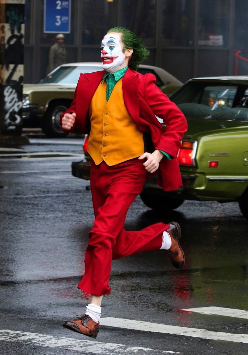 NerdwithBalls's tweet photo. Our boy Joaquin Phoenix out here doing his thing as The Joker in new set photos! 🃏 👀 https://t.co/JkDHA02uny https://t.co/B2YXmJIqqb
