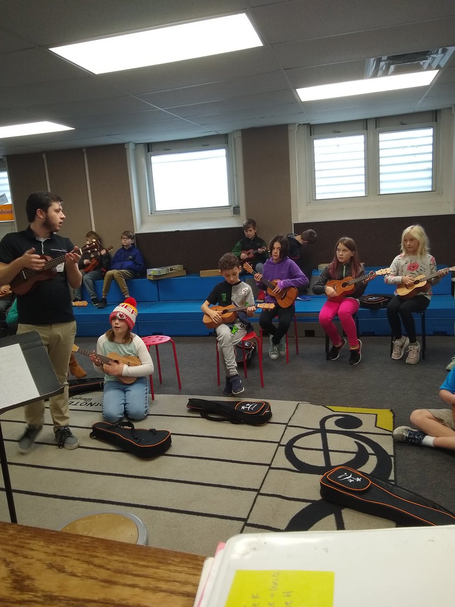 drwichard's tweet photo. Day 1 of ukulele with 4th and 5th. Happy to have @umsl Student Teacher #MrHarris to teach all of us! #wgbuzz #alwayslearning https://t.co/ddVfl661FT