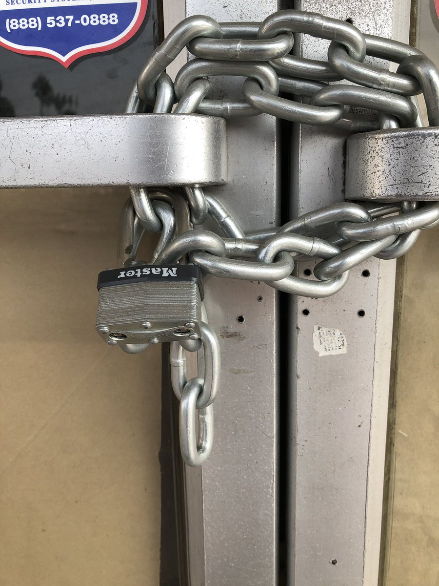 LockPorn's tweet photo. Master lock #510D on the front of a closed up shop. This is a warded lock and yes, it’s installed upside down. This sets the bar to a new low.
#lockfail https://t.co/YPqYbmmCV9