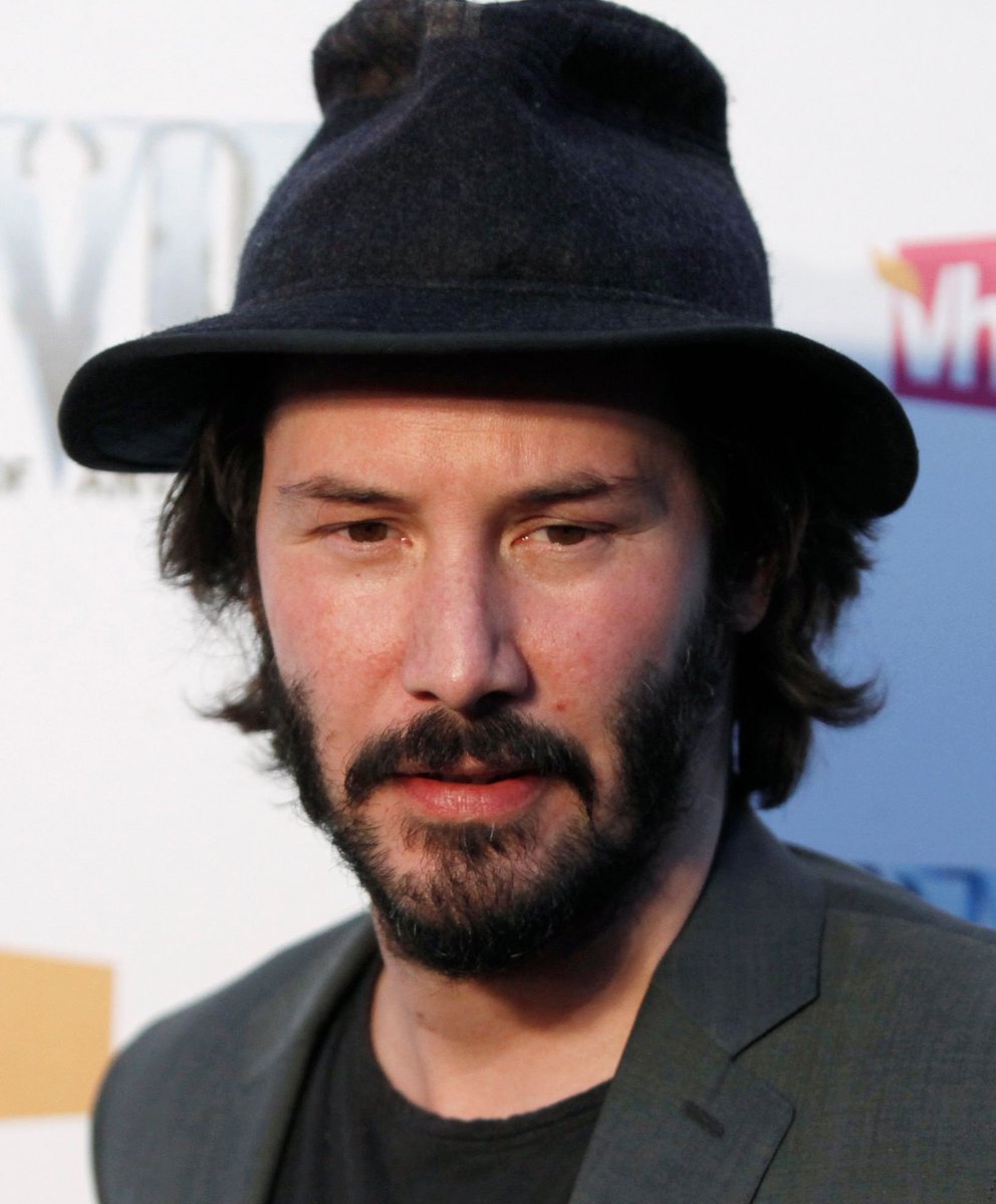 keanu reeves wearing a fedora 