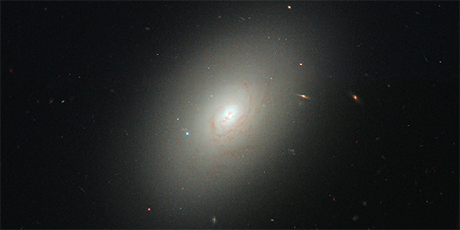 HubbleTelescope's tweet photo. How do elliptical galaxies churn out new stars? By colliding with a nearby gas-rich galaxy! Some of the stars in NGC 4150 are only 300 to 400 million years old thanks to a smashup with a nearby dwarf galaxy. https://t.co/b3xotHaxMD #StarFormation #HubbleHistory https://t.co/F0x0zPDZu3