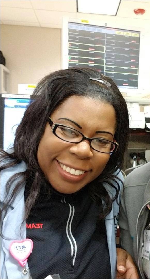 Earlier today, during her ER shift. She was a beloved doc at Mercy. That smile.