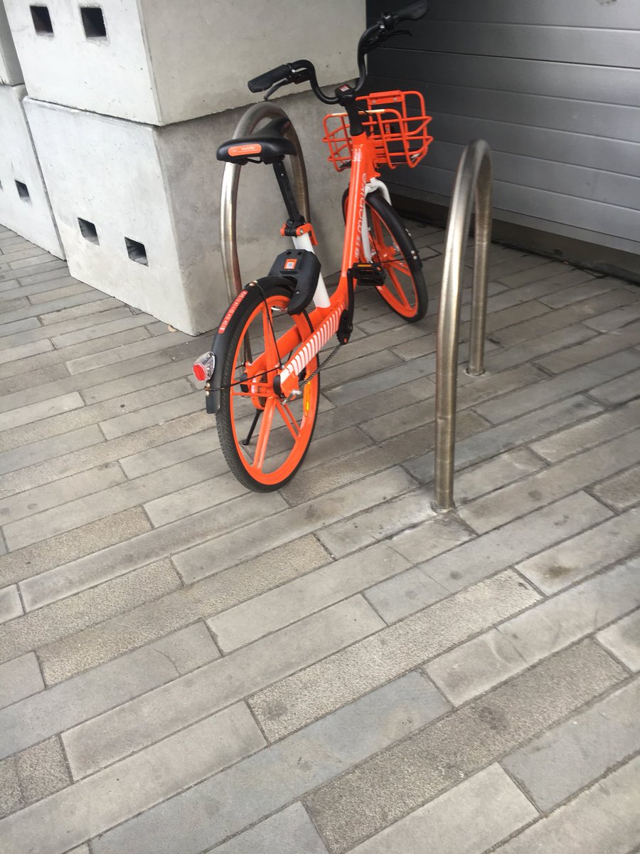 Kavobytes's tweet photo. @Mobike @MobikeAU I’m literally parked in a bike rack. Clearly in a legal parking area... yet you’ve charged me a penalty and won’t let me unlock the bike?! You’ve gotta be joking! #mofail #mobail https://t.co/MNmkm8maJQ