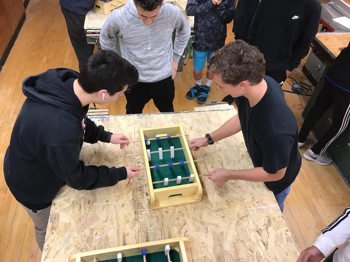 HauppaugeTechEd's tweet photo. HHS Technology Education students in Materials Processing compete in a foosball tournament with the tables they worked to create from scratch in class. Players were made on the CNC router and the ball was 3D printed. #weloveteched #foosballislife https://t.co/LBygZComL3