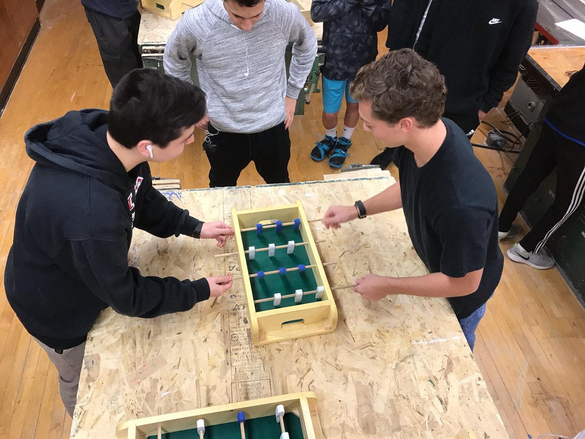 HauppaugeTechEd's tweet photo. HHS Technology Education students in Materials Processing compete in a foosball tournament with the tables they worked to create from scratch in class. Players were made on the CNC router and the ball was 3D printed. #weloveteched #foosballislife https://t.co/LBygZComL3