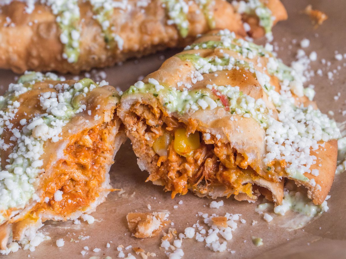 HightideBurrito's tweet photo. Fall has us really craving these Empanadas! Enjoy a fresh #chicken or #beef stuffed #pastry, fried and topped with cotija cheese and #avocado crema (2 per order). Surprise someone with a delivery to their home or office! 🙏🏼 #Jacksonville #Florida #mexicanfood #904 #empanada https://t.co/qykXaI9sOH