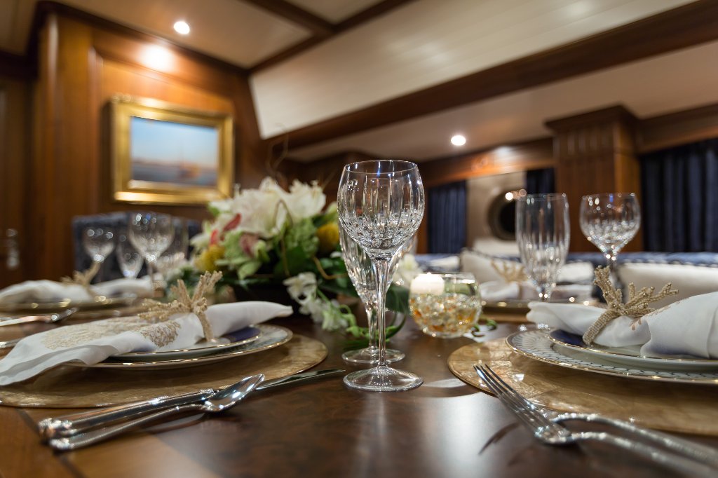 SY_Marae's tweet photo. The chef is preparing the meal and the table is set for a delicious dinner with family and friends onboard Marae.  What would you like to celebrate on charter?

Photo by Jeff Brown @BreedMedia https://t.co/d1D5ZXwcrU