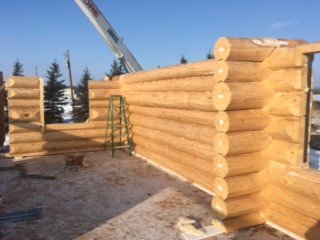 MH_WoodS's tweet photo. Reassemble has begun on the new site in the Gibbons area. The deck posts have been placed over the walkout basement and the log rounds have been set and anchored over the concrete basement. Now for the interior work! #logbuilder #loghome #loghomesalberta https://t.co/MPoofSvYpZ