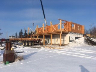 MH_WoodS's tweet photo. Reassemble has begun on the new site in the Gibbons area. The deck posts have been placed over the walkout basement and the log rounds have been set and anchored over the concrete basement. Now for the interior work! #logbuilder #loghome #loghomesalberta https://t.co/MPoofSvYpZ