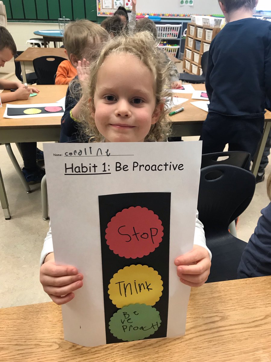 otsprincipal's tweet photo. A Kindergarten student proudly displays her learning around Leader In Me Habit 1: “Be proactive.” https://t.co/YzTPcKq2HI