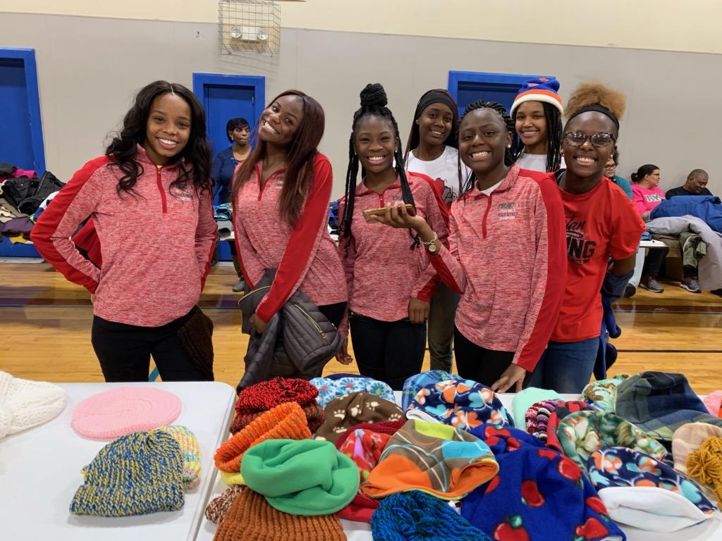 LimaCitySchools's tweet photo. Lima Senior Lady Spartan Track Team serving the community at the Bradfield Community Center's "Three Part Blessings Giveaway." #spartansgiveback https://t.co/jZOdWi9EUn