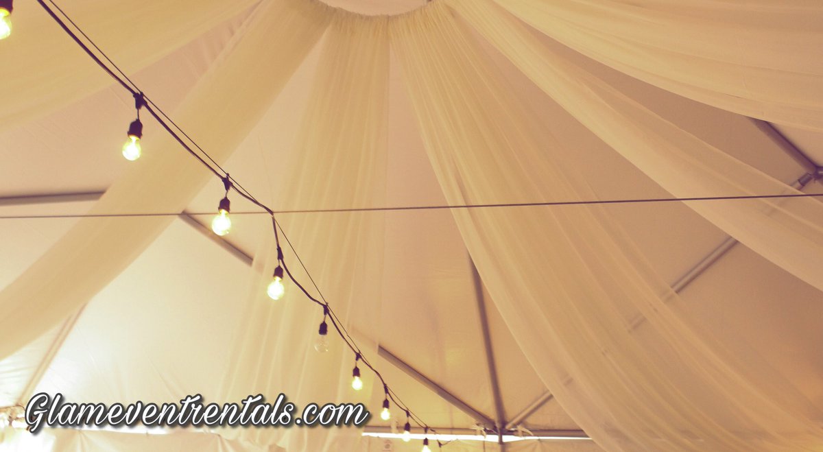 Mbryzia's tweet photo. It was so much fun creating this warm &amp; cozy starburst ceiling drape look for Mickey Spillane’s Pub patio tent! Glameventrentals at it again #design #decor #partydecorations #backdrops #chiavarichairs #ghostchairs #foldingchairs #ghosttable #events #eventplanning https://t.co/bqYg17lgIQ