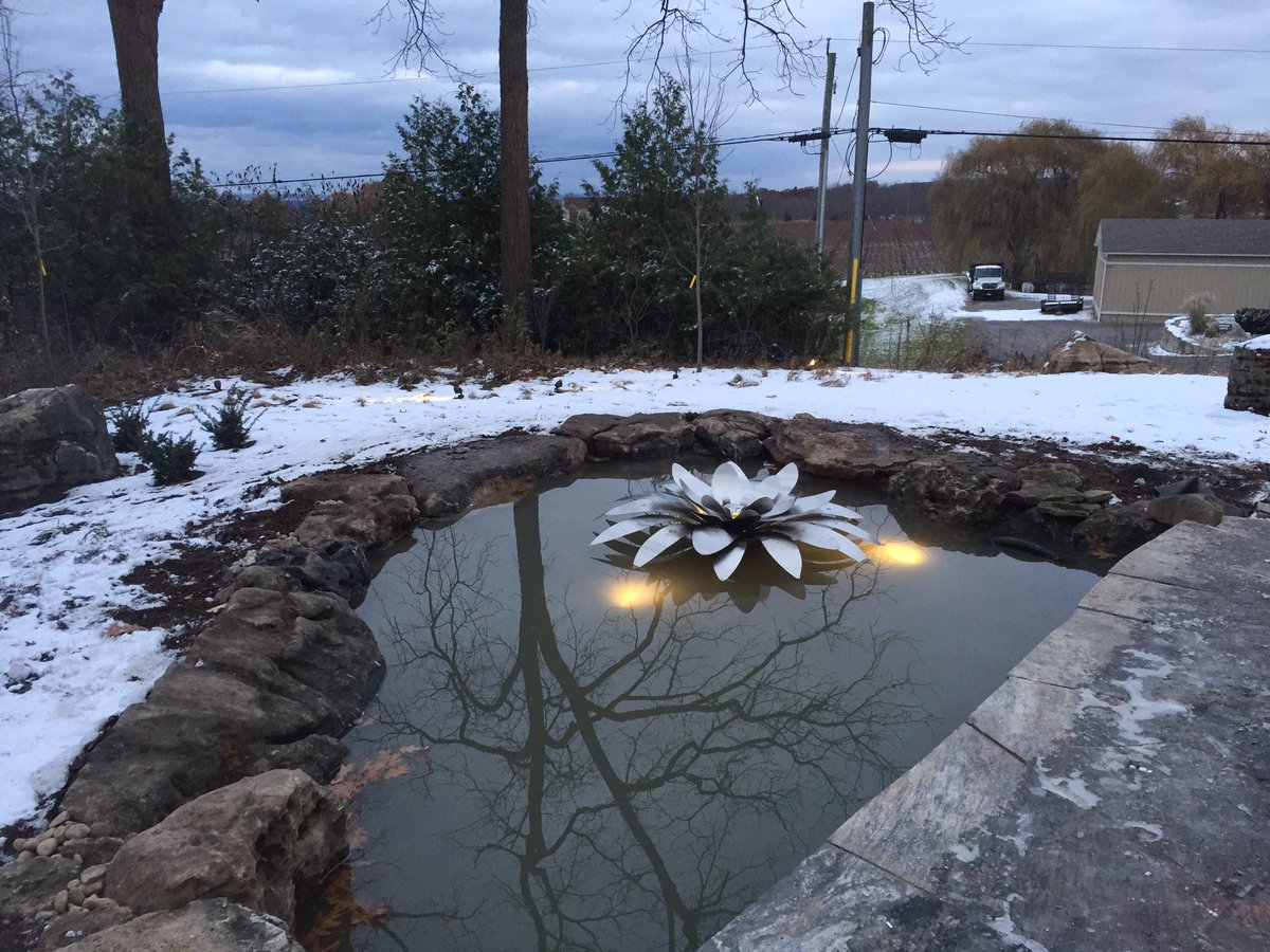SteelCityPalms's tweet photo. We’re always so fortunate to be part of amazing projects...there were so many wow factors incorporated into this one. Today we were thrilled to introduce our latest custom creation to our clients - the #steellotus! #landscapedesign #reflectionpond  #steelart https://t.co/01J1CCon0W