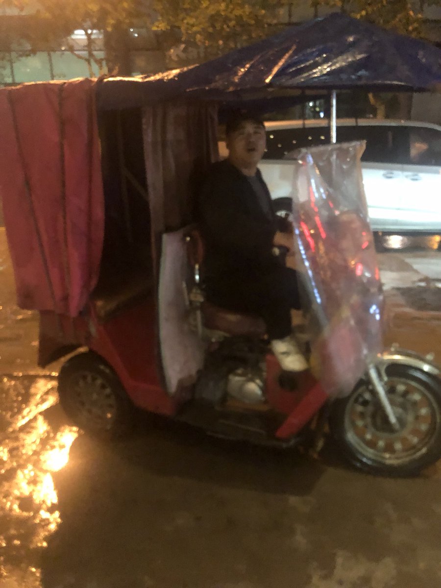 China always amazes me. Stuck in rain late last night. No cabs in sight or on Didi. This guy shows up in a make shift covered scooter! Even he accepts mobile payment!