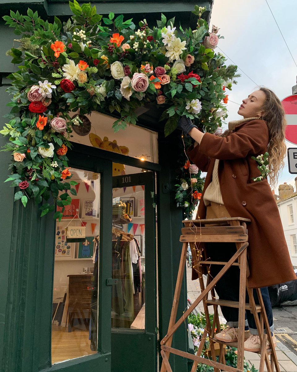 YAY Phohm is adding the finishing touches to our Christmas floral arch 🎄🌿  PHOHM.CO.UK