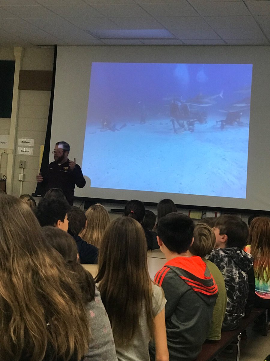 MrsThomsen1's tweet photo. Superintendent Mr. Scott Gates presented to Team Spirit 5th grade about underwater habitats and biodiversity. The students were treated to a virtual scuba dive experience with sharks! https://t.co/hst6yYwsU6