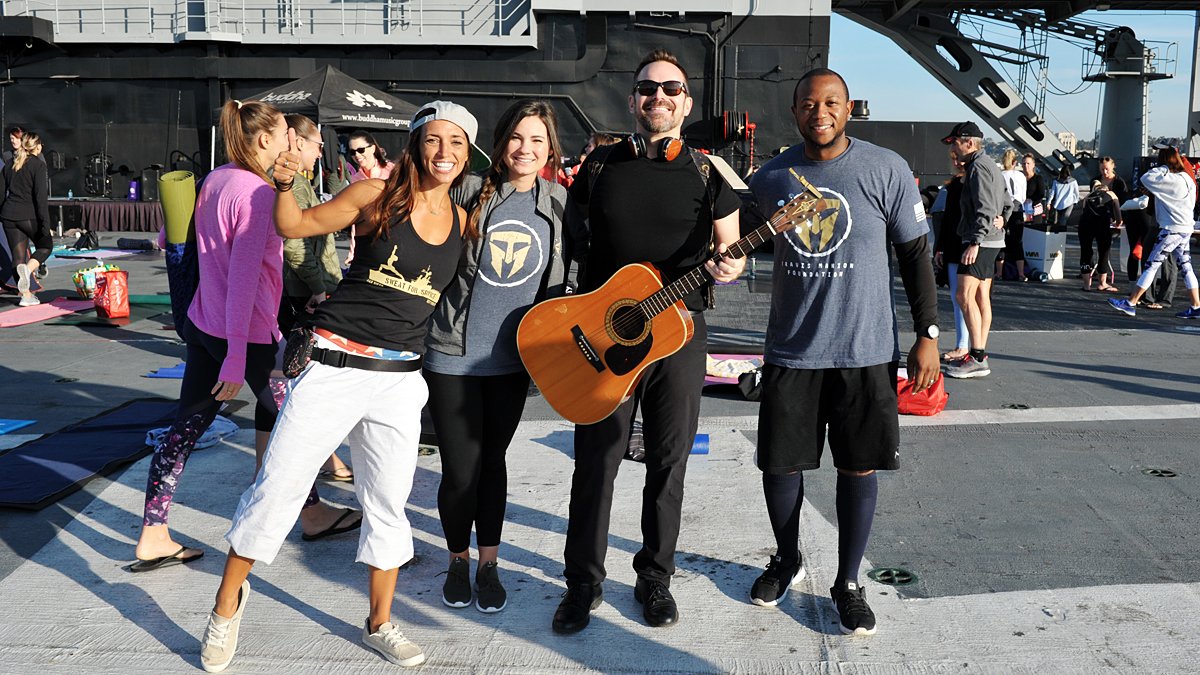 PacificSD's tweet photo. SPOTTED: Yogis at Sweat for Service experienced a dynamic yoga session aboard the @USSMidwayMuseum to raise funds for the families of fallen soldiers | Pics by #RickNocon | More here: https://t.co/tQ1qus75ee https://t.co/VFdpTSNh7V