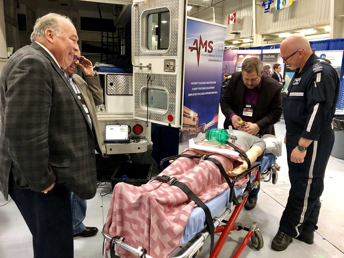 AdvancedMedic's tweet photo. NWT Premier Bob McLeod is entertained while NWT Heath Minister Glen Abernathy performs Advanced Airway Support on our Simman3g Mannikin! #TradeshowFun #GeoscienceForum #HeathcareEducation https://t.co/ljJLc9Bogn