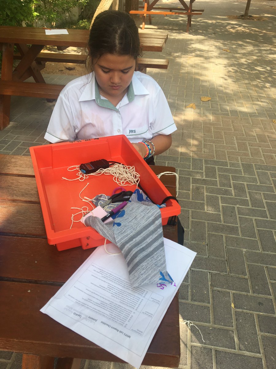Science_JBS's tweet photo. @Grade_6_JBS  Grade 6 scientists launch parachutes!  Lizzy concentrates on adjusting the string length.  I have never seen such an organised tray as Adams.  #inspiringyoungminds #leadersofthefuture https://t.co/mtRDbiWGXX