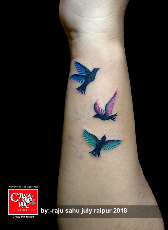 Colorful Bird Tattoo on Woman's Shoulder and Chest