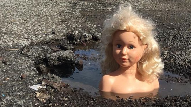 HenryRoads's tweet photo. There have been lots of campaigns designed to highlight the #pothole problem.  This one has to be one of the most memorable (and creepy) #ThrowbackThursday #TBT https://t.co/SzlLUraNhx https://t.co/zT2AsSIlnr