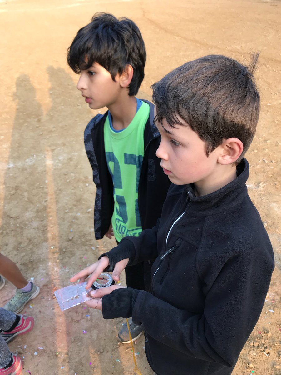 TBSYear4's tweet photo. Using compasses for a scavenger hunt #Lubhu2018 https://t.co/QmRCJ3mKpu