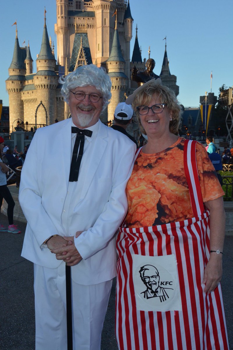 PubGrubFood's tweet photo. @kfc we went to Disney Halloween and were the hit of the evening. Everyone wanted their pics with the Colonel and his favorite Bucket!!! BTW- it was the night before our wedding ❤️ #halloWedding2018 https://t.co/etZFRxkwj8