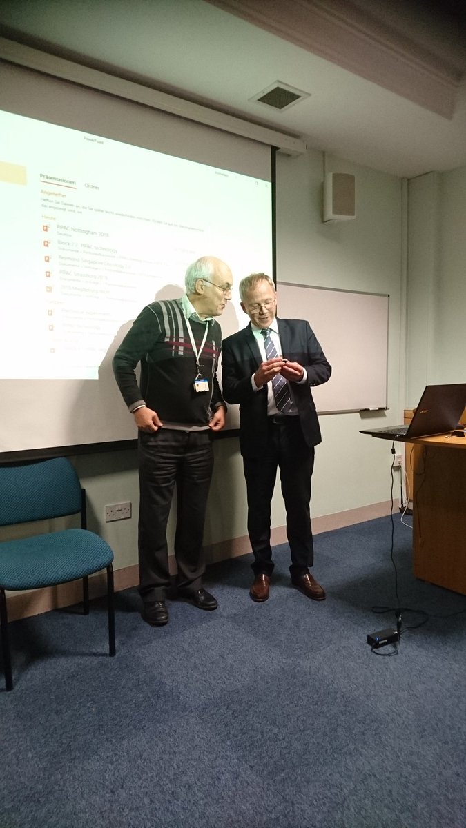 jimgthornton's tweet photo. Prof Marc Raymond inspecting his Jurassic gryphaea fossil from Atlantic College in South Wales #PIPEC #FossilMeeting https://t.co/KPMDfYTPiO