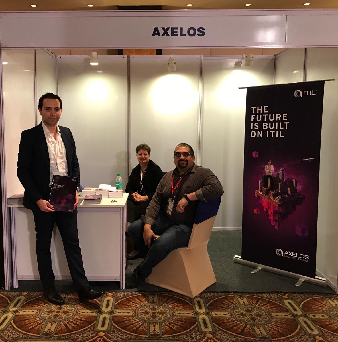 AXELOS_GBP's tweet photo. If you're attending @itSMFIndia, pass by the AXELOS stand and say hello to @ribero_luis, @cathnewm and @bloreboy and ask them any #ITIL questions you may have! #BuiltOnITIL https://t.co/Z2a69qTNAb