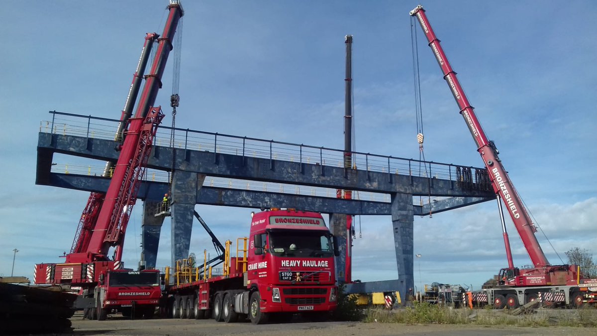 4 of our heavy cranes preparing to ''quad lift'' a redundant dock side crane. #cranehire #bronzeshield #cranes