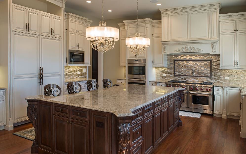 emsertile's tweet photo. #EmserTile Design of the Week: Double chandeliers and a metallic trapezoid backsplash stun in this #Studio41 kitchen, seen here with Imagine Prospect. https://t.co/kehWkh0LcC https://t.co/kXTtjMJGl6