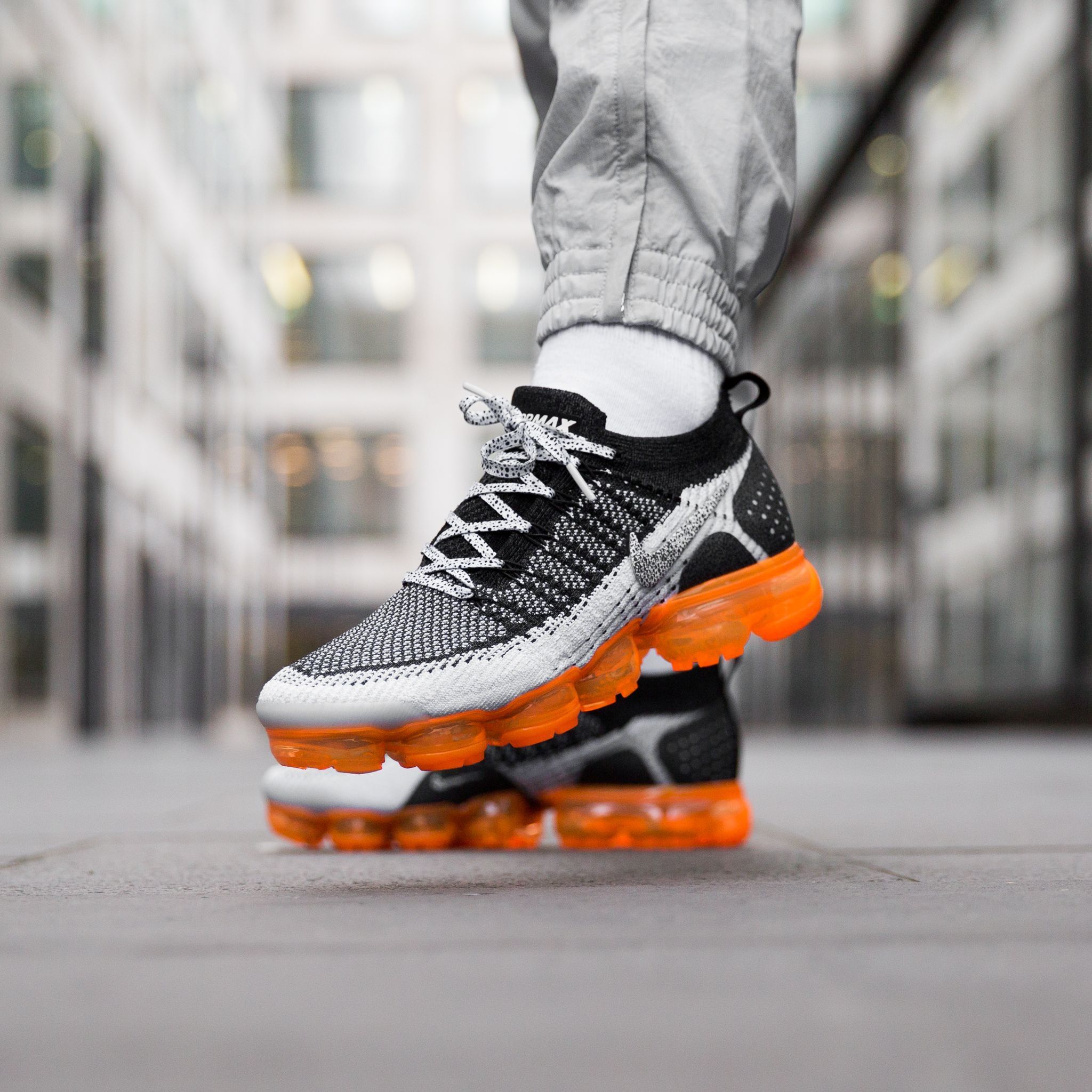 orange and white vapormax flyknit