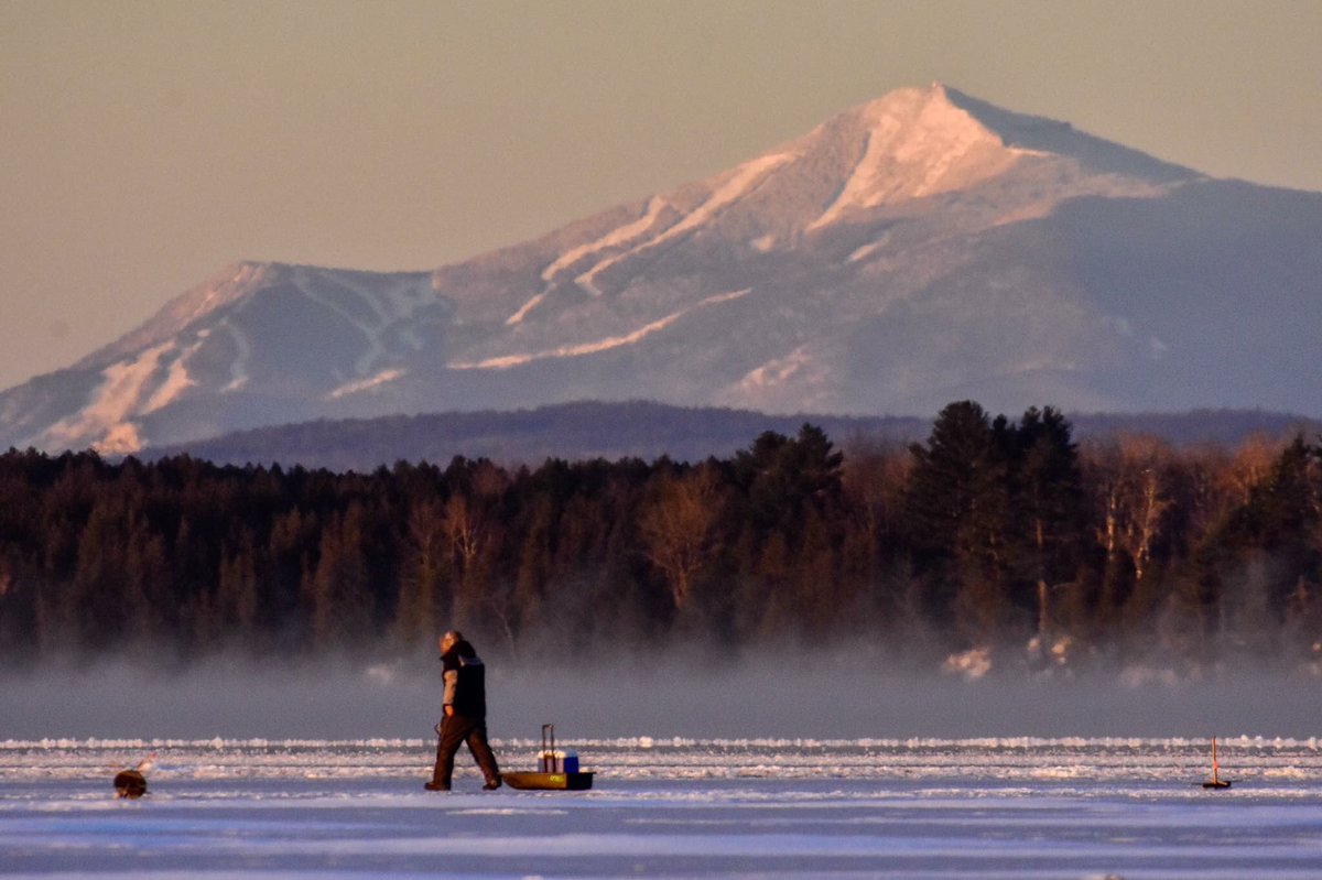 TheIslanderNews's tweet photo. Record cold temps in VT. An early season ice fisherman works the waters of Lake Champlain on new ice south of the Sandbar Causeway at sunrise Friday as Whiteface Mountain, N.Y. looms in the background in morning light. Photo: Rob Swanson
 #OnlyInTheIslands #vermont https://t.co/RiHUAcOQFc