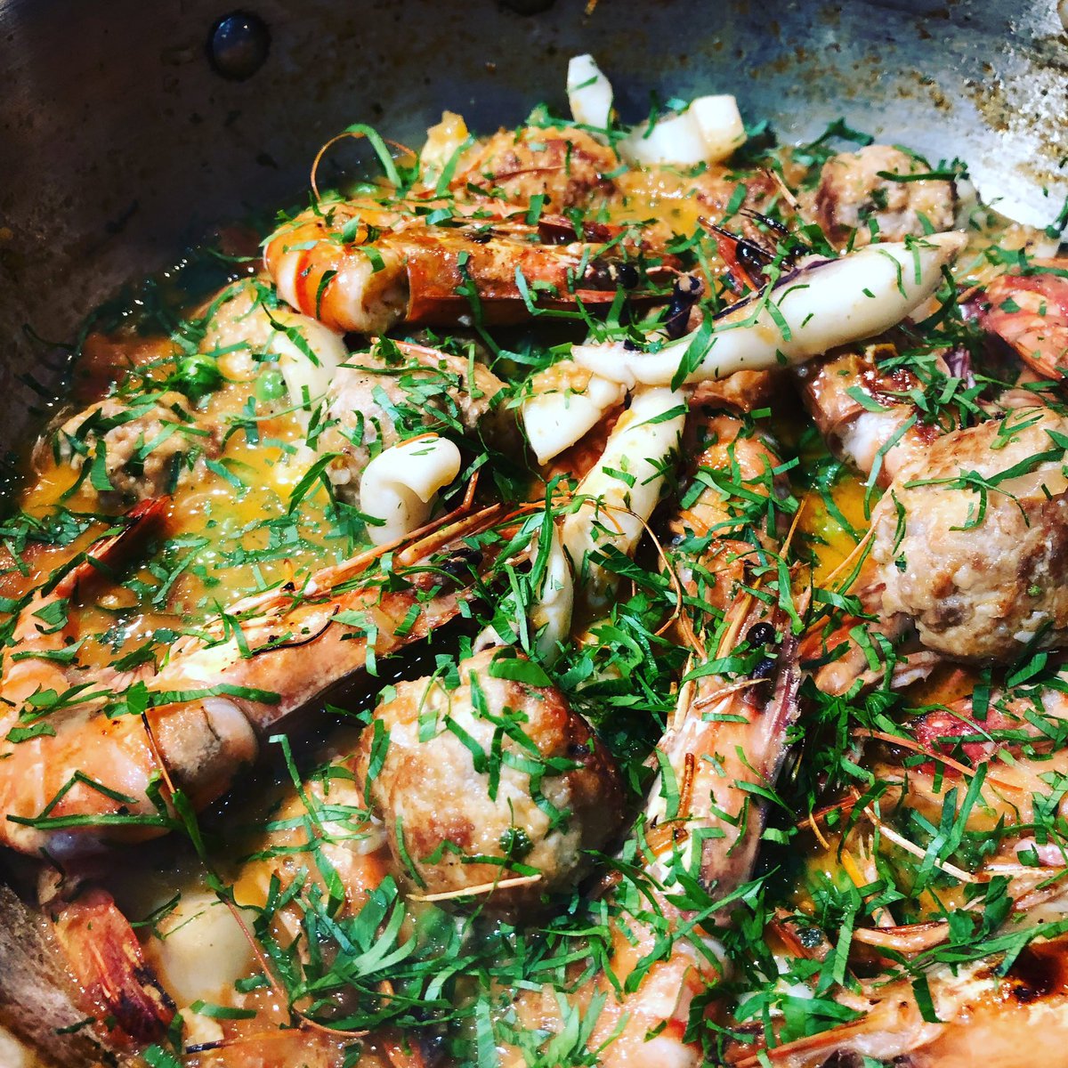 RickSteinSchool's tweet photo. Our head chef @DeliNick is cooking this beautiful dish of cuttlefish, meatballs, prawns and peas @PadstowXmas on Saturday 8th 17:15 - why not come on down and say hello!! #padstow #PCF18 #cornishfish #winteriscoming https://t.co/7iRQz97dx0