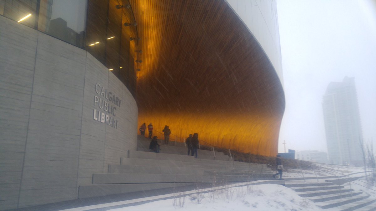 SWebner's tweet image. The new Calgary Public Library downtown in a bit of a snow storm.