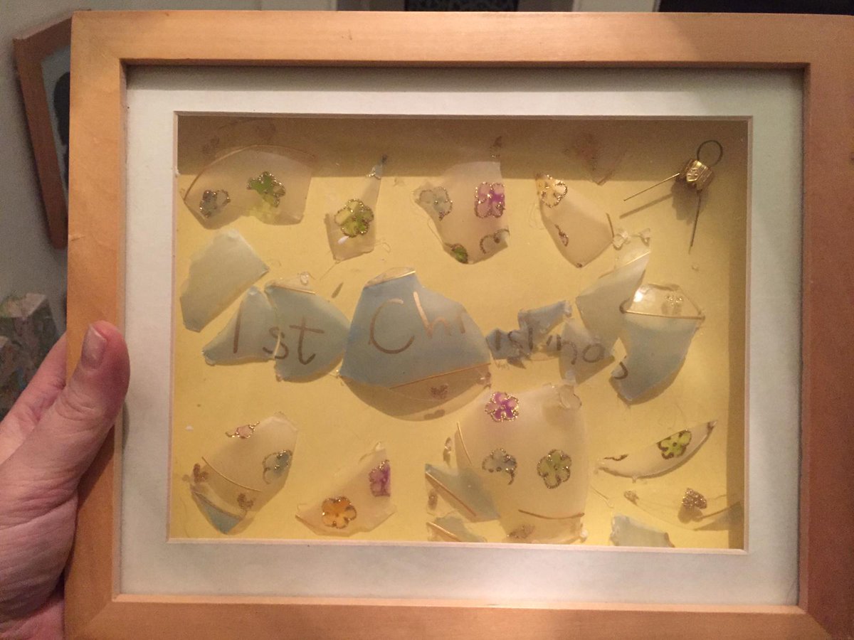 My son was devastated to find his first Xmas bauble had fallen and smashed, so we gathered up the pieces and my wife made a little memorial picture.